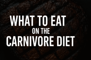 Grilled steak hero image with white text showing what to eat on the carnivore diet.