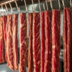 Beef strips hanging to dry for homemade biltong.